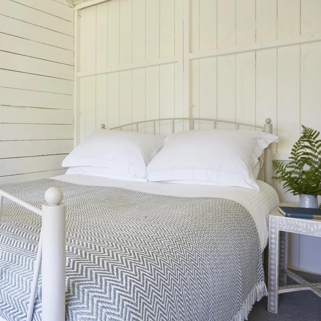 Dove Grey Herringbone Blanket on bed